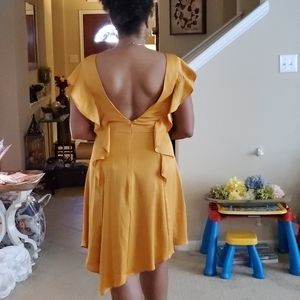 Gold lowback dress.
